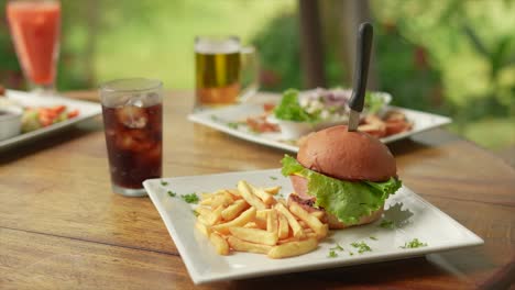 hamburger-with-fries-and-soft-drink,-SUMMER-DAY,-next-to-ceviche