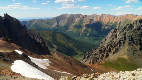 Southern-Colorado-summer-snowy-dreamy-Rocky-Mountains-San-Juan-top-of-peaks-Ice-Lake-Basin-Trail-toward-Silverton-Telluride-Ouray-Red-Mountain-Molas-Pass-top-of-the-world-slow-pan-still-movement-left