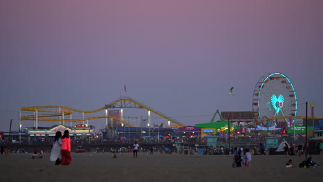Santa-Monica-Pacific-Pier-Park-and-amusement-rides-at-dusk---slow-motion