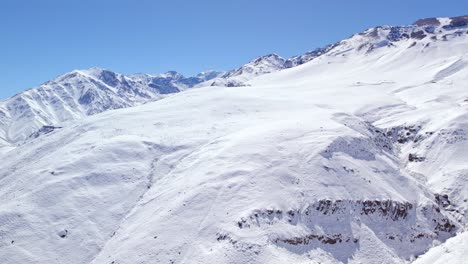 Vista-Aérea-Panorámica-De-La-Cordillera-De-Los-Andes-Nevada-En-Un-Día-Soleado,-Chile