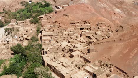Flying-over-Tuyugou-Chinese-remote-adobe-buildings-village-in-desert