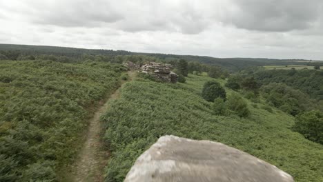4k-Aerial-fly-over-of-Bridstones-sandstone-rock-formations-in-Dalby-Forest,-North-Yorkshire
