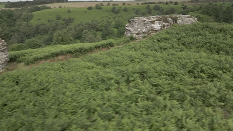 4k-Aerial-orbiting-footage-of-Bridstones-sandstone-rock-formations-in-Dalby-Forest,-North-Yorkshire