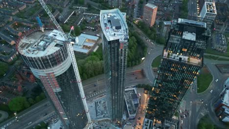 Aerial-drone-flight-of-a-new-development-underway-of-the-Three60-building-at-Deansgate-Square-in-Manchester-City-Centre