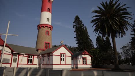 A-side-angle-of-the-historical-Swakopmund-lighthouse-against-a-blue-sky