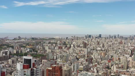 Aerial-panoramic-view-of-Buenos-Aires,-Argentina,-drone-flying-forward-over-Las-Heras-park