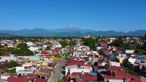 spectacular-drone-view-of-the-Citlaltepec-volcano-from-Cordoba,-Veracruz,-Mexico