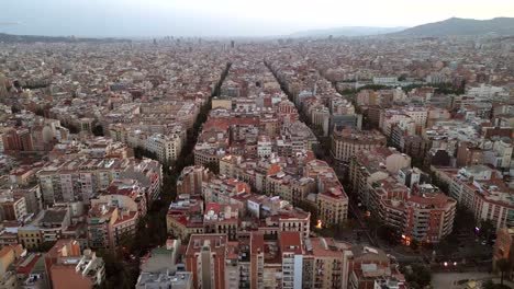 An-Aerial-drone-shot-of-the-city-center-of-Barcelona-featuring-Catalonia-Community's-new-and-old-buildings