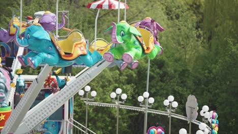 A-carousel-with-elephant-shaped-seats-in-the-amusement-park