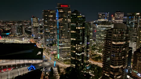 Vancouver-BC-Canada-Aerial-v2-hyperlapse-flyover-harbor-waterfront-area-capturing-buzzing-downtown,-illuminated-night-cityscape-and-traffics-on-Cordova-street---Shot-with-Mavic-3-Pro-Cine---July-2023