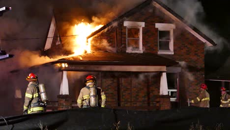 A-group-of-firefighters-battling-a-house-fire-in-Brampton