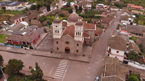 Aerial-View-of-Cathedral-Church-and-Neighborhood-Surrounding-Buildings-in-Small-Town-in-Pasa-Ecuador