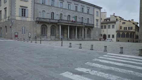 Woman-Standing-Outside-The-Palazzo-della-Provincia-Of-Arezzo-In-Tuscany,-Italy