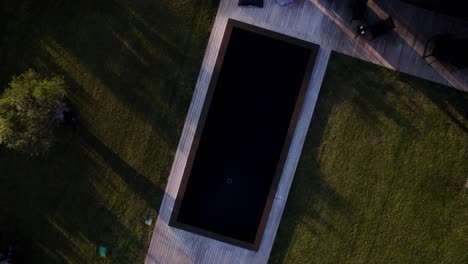 Aerial-rising-shot-of-a-luxury-villa-in-Uzès-with-a-private-pool-at-dusk