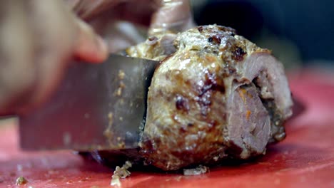 Hand-With-Knife-Chopping-Meat-Barbecue.-Close-Up