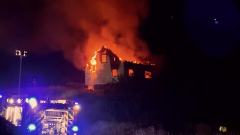 Fire-burns-down-house-with-police-and-firefighters-watching