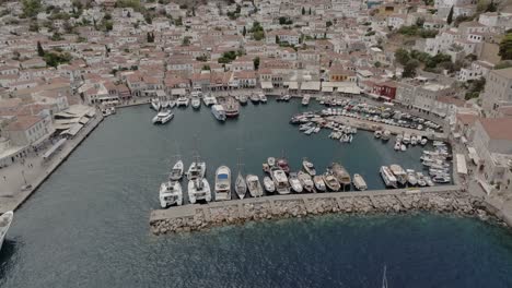 Aerial-reveal-of-Hydra-port-in-Hydra-island,-Greece
