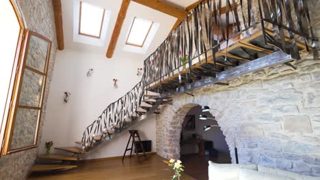 Luxury-holiday-French-limestone-interior-of-guest-house-with-quirky-structured-stair