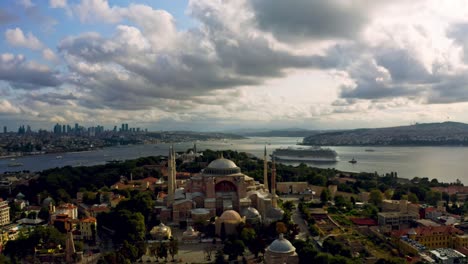 An-awe-inspiring-encounter-between-artistry-and-nature:-Istanbul's-Blue-Mosque-amidst-sunset's-radiance,-embraced-by-immense,-billowing-clouds
