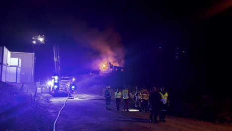 Norwegian-emergency-response-firefighters-and-police-rushing-out-to-manage-a-burning-house
