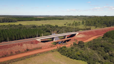 Drone-approaching-a-rural-construction-site-bridge