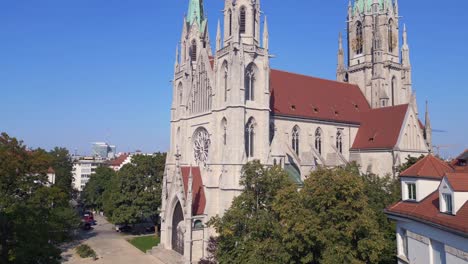 Fantastic-aerial-top-view-flight-Munich-city-Paul-Church-at-theresienwiesen,-Germany-Bavarian-Town-at-sunny-clear-sky-day-2023