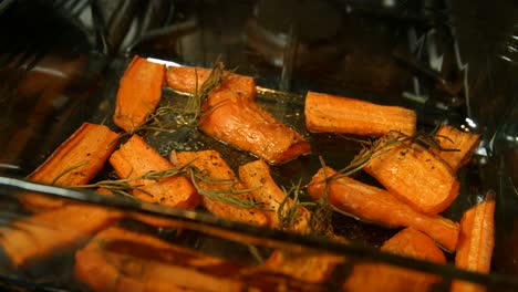 Tray-of-Roasted-Carrots-with-Rosemary-and-Hot-Oil-Bubbling