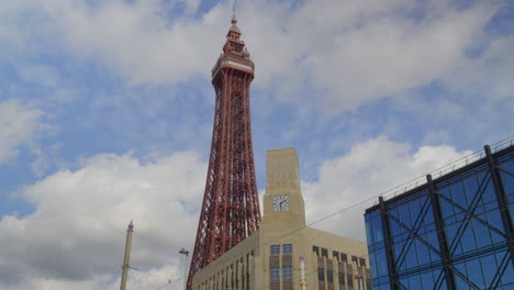 Blackpool-Tower-moving-in-and-out-of-shadow-with-fluffy-clouds-massing-behind-on-summer-day