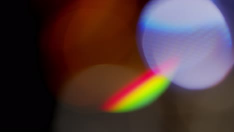 Multicolored-light-leaks-4k-footage-on-black-background,-Stylizing-video,-transitions,-Bokeh-effect