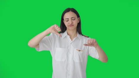 Disappointed-Indian-woman-pilot-showing-thumbs-down-Green-screen