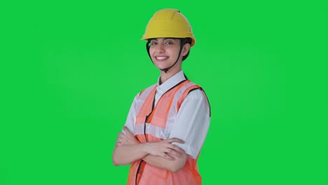 Portrait-of-Happy-Indian-female-architect-standing-crossed-hands-Green-screen