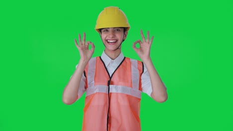 Happy-Indian-female-architect-showing-okay-sign-Green-screen