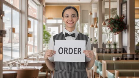 Happy-Indian-woman-waiter-holding-ORDER-banner