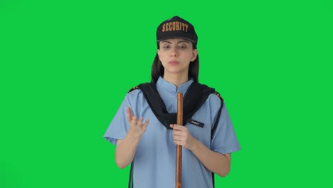 Indian-female-security-guard-talking-to-someone-Green-screen