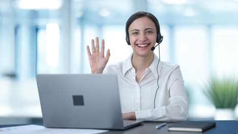 Happy-Indian-call-center-girl-waving-Hi-to-the-camera