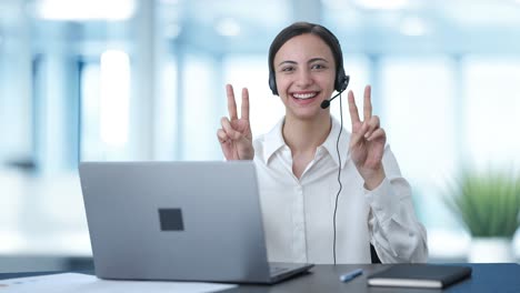 Happy-Indian-call-center-girl-showing-victory-sign