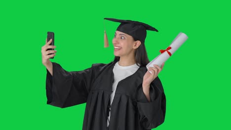 Happy-Indian-college-graduate-girl-talking-through-video-call-Green-screen
