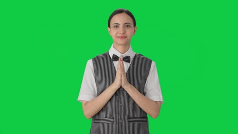 Happy-Indian-woman-waiter-welcoming-customers-Green-screen