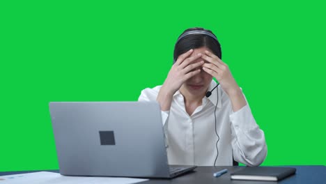 Stressed-tensed-Indian-call-center-girl-talking-to-the-customer-Green-screen