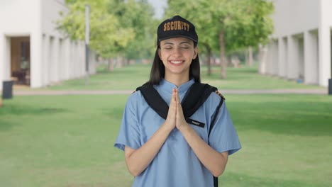 Happy-Indian-female-security-guard-doing-Namaste