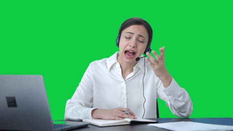 Angry-Indian-call-center-girl-talking-to-customer-and-taking-notes-Green-screen