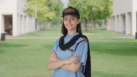 Portrait-of-Happy-Indian-female-security-guard-standing-crossed-hands