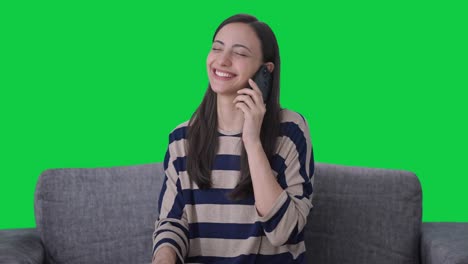 Happy-Indian-girl-talking-on-phone-Green-screen