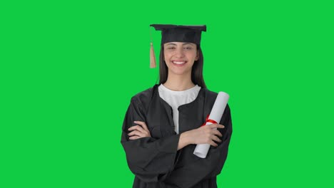 Happy-Indian-college-graduate-girl-standing-crossed-hands-Green-screen