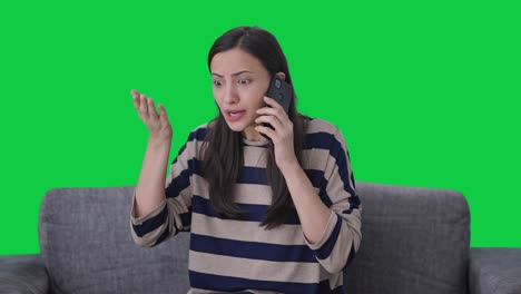 Angry-Indian-girl-talking-on-phone-Green-screen