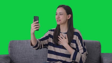 Happy-Indian-girl-talking-on-video-call-Green-screen