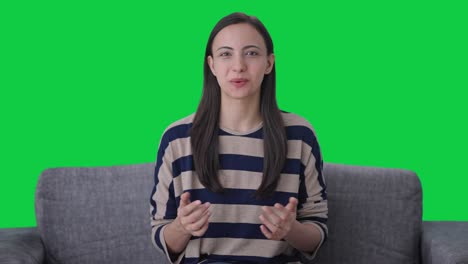 Happy-Indian-girl-talking-to-the-camera-Green-screen