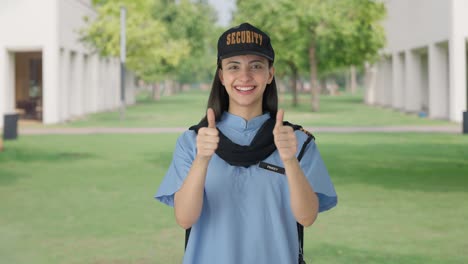 Happy-Indian-female-security-guard-showing-thumbs-up