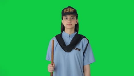 Indian-female-security-guard-standing-on-duty-Green-screen