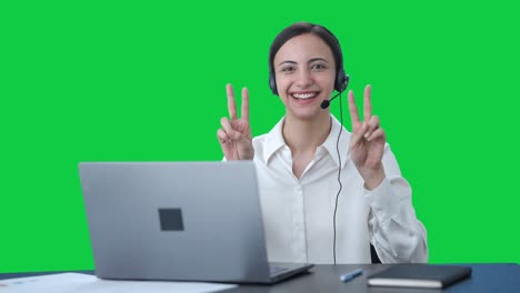 Happy-Indian-call-center-girl-showing-victory-sign-Green-screen